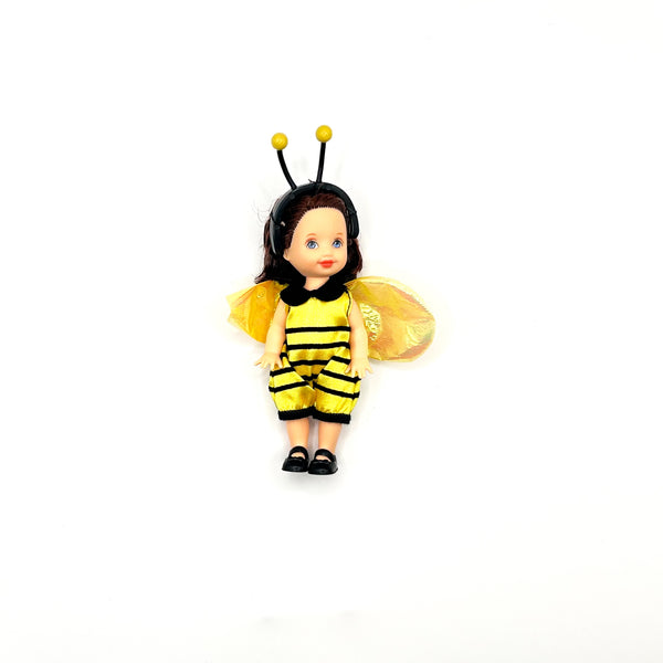 Vintage Mattel Barbie Kelly Club Bumblebee Melody doll (2001) in a sleeveless striped bumblebee jumpsuit costume, featuring delicate yellow fabric wings and a matching antenna headpiece on a clean white background