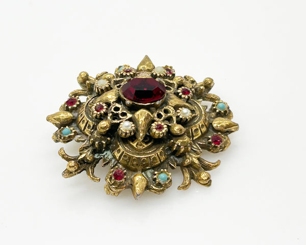 Vintage Ornate Brooch with Glittering Red Center