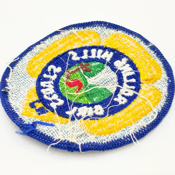 Girl Scouts patch with 'Rolling Hills Girl Scouts' text on a white background