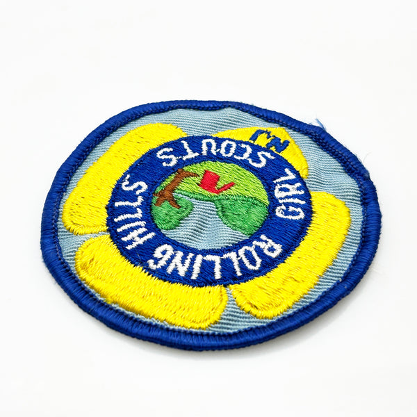 Girl Scouts patch with 'Rolling Hills Girl Scouts' text on a white background