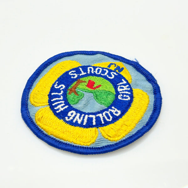 Girl Scouts patch with 'Rolling Hills Girl Scouts' text on a white background