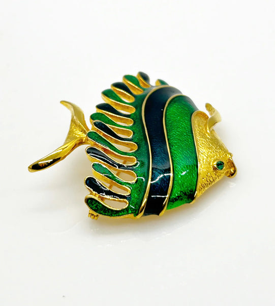 This charming angel fish brooch is a work of art with its vibrant blue and green enamel on a golden backdrop. His vibrant green eye will see all of the compliments you'll receive.