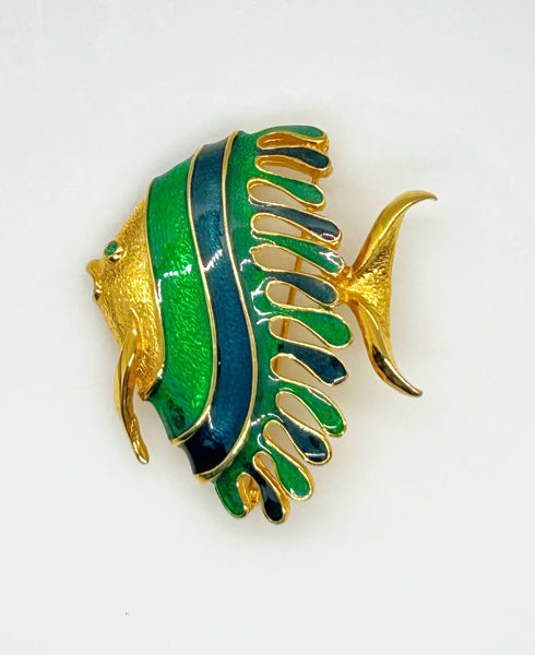 This charming angel fish brooch is a work of art with its vibrant blue and green enamel on a golden backdrop. His vibrant green eye will see all of the compliments you'll receive.