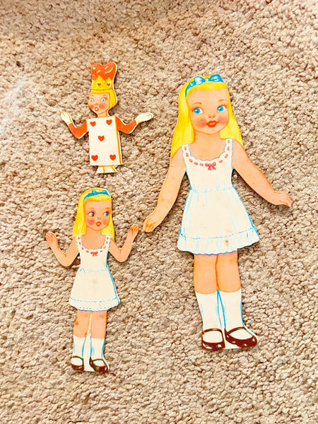 This is a vintage boxed set of "Animated Alice in Wonderland Dolls" paper dolls manufactured by the Milton Bradley Company. The set, number 4109, was designed by Emma C. McKean and includes seven scene cards where the dolls can be inserted into die-cut slits to "animate" the scenes.