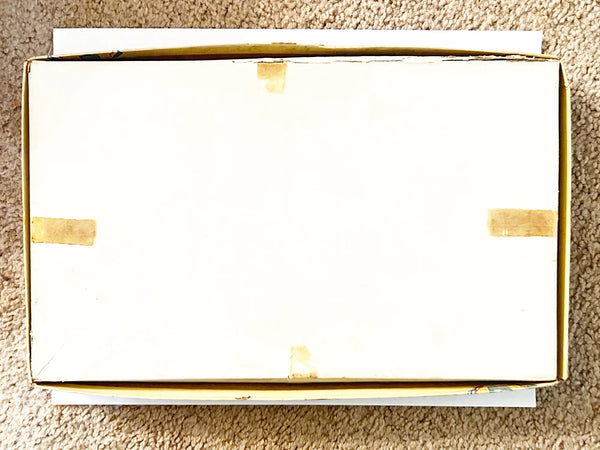 This is a vintage boxed set of "Animated Alice in Wonderland Dolls" paper dolls manufactured by the Milton Bradley Company. The set, number 4109, was designed by Emma C. McKean and includes seven scene cards where the dolls can be inserted into die-cut slits to "animate" the scenes.