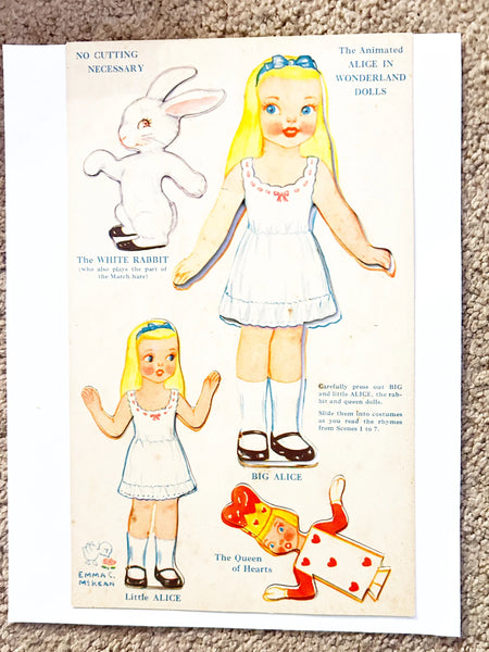 This is a vintage boxed set of "Animated Alice in Wonderland Dolls" paper dolls manufactured by the Milton Bradley Company. The set, number 4109, was designed by Emma C. McKean and includes seven scene cards where the dolls can be inserted into die-cut slits to "animate" the scenes.