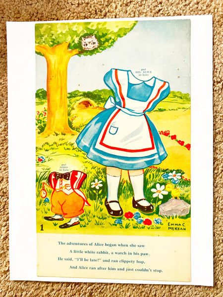 This is a vintage boxed set of "Animated Alice in Wonderland Dolls" paper dolls manufactured by the Milton Bradley Company. The set, number 4109, was designed by Emma C. McKean and includes seven scene cards where the dolls can be inserted into die-cut slits to "animate" the scenes.