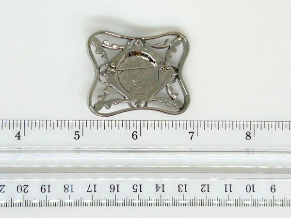 Perfect for vintage Avon enthusiasts: our Bold and Classic Medieval Style Pin with Purple Stone provides timeless elegance and bold sophistication. Shop today!