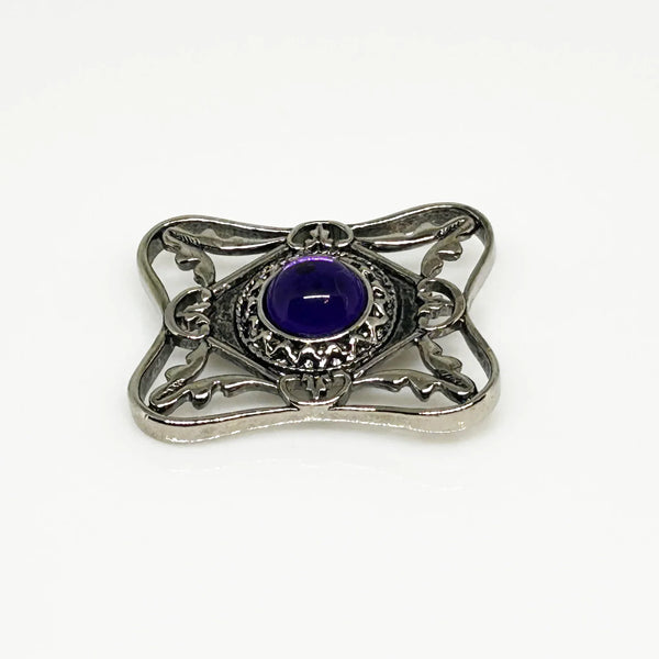 Perfect for vintage Avon enthusiasts: our Bold and Classic Medieval Style Pin with Purple Stone provides timeless elegance and bold sophistication. Shop today!
