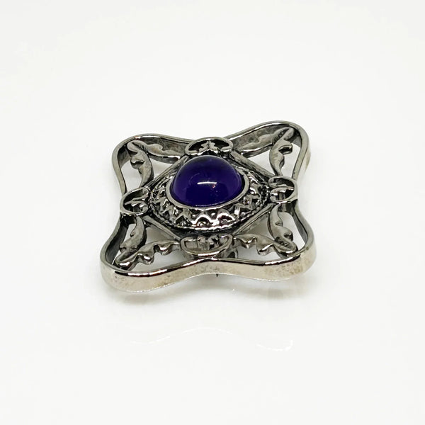Perfect for vintage Avon enthusiasts: our Bold and Classic Medieval Style Pin with Purple Stone provides timeless elegance and bold sophistication. Shop today!