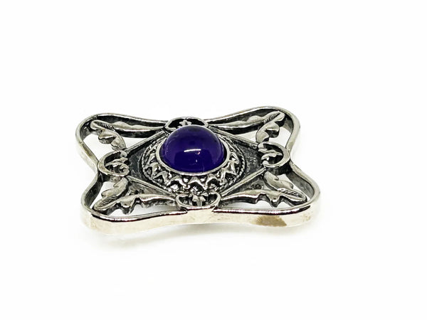 Perfect for vintage Avon enthusiasts: our Bold and Classic Medieval Style Pin with Purple Stone provides timeless elegance and bold sophistication. Shop today!
