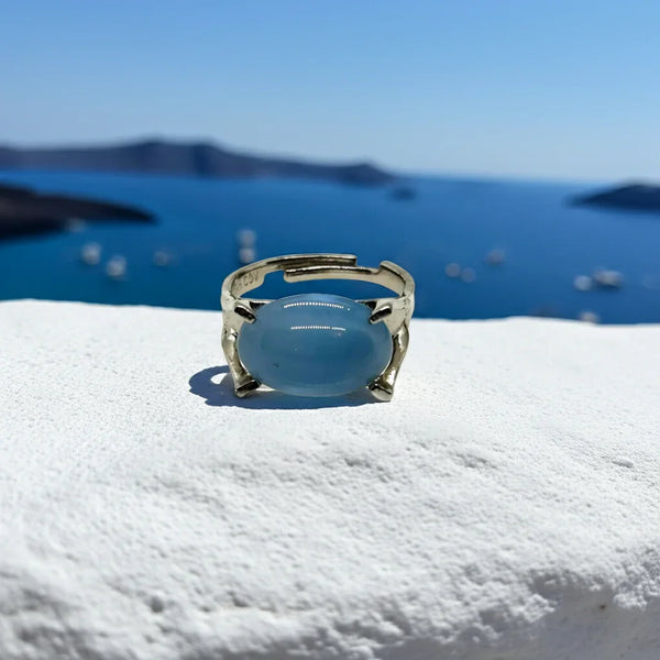 Here's our captivating vintage Sarah Coventry "Beauty Glow" ring, estimated to be from the year 1966. This exquisite piece showcases a mesmerizing, translucent, blue cabochon stone.