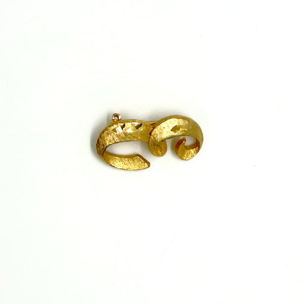 A small, vintage gold-tone initial "E" cursive monogram brooch pin, featuring a dual-textured finish with brushed matte styling and diamond-cut highlights on a plain white background