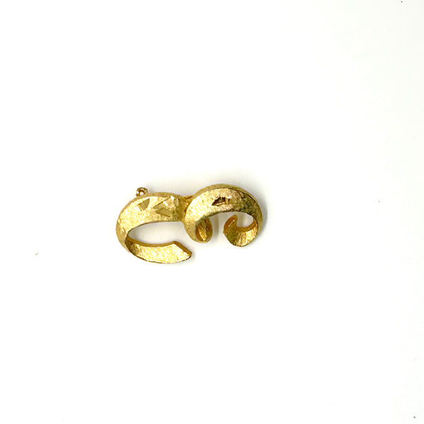 A small, vintage gold-tone initial "E" cursive monogram brooch pin, featuring a dual-textured finish with brushed matte styling and diamond-cut highlights on a plain white background