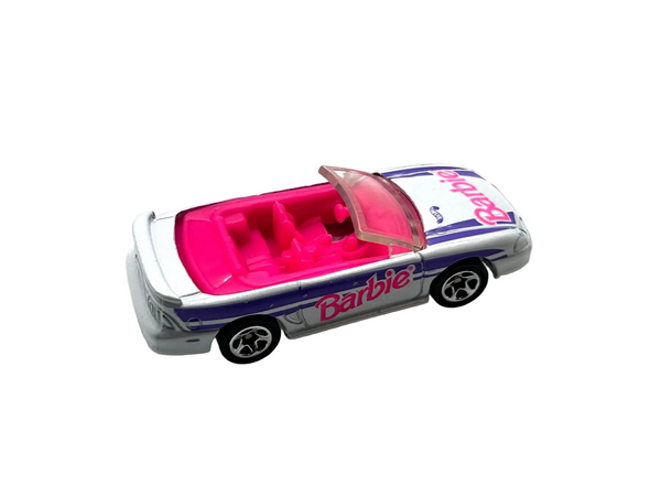 Hot Wheels Barbie 1996 Ford Mustang GT convertible, featuring a silver exterior with purple and pink branding.