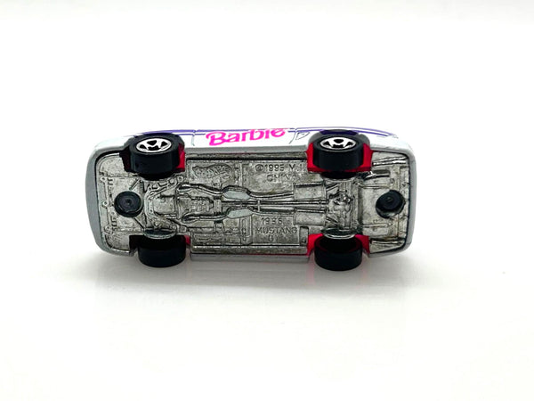 Hot Wheels Barbie 1996 Ford Mustang GT convertible, featuring a silver exterior with purple and pink branding.