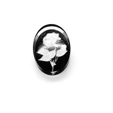 oval cameo brooch depicting a white rose with leaves carved against a dark, polished background. 