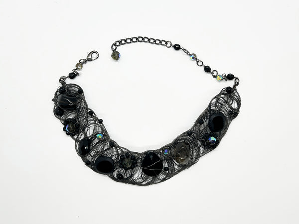 Black woven wire with stones necklace and adjustable fit for unique edgy style and bold elegance. The artistry and stunning apparance will make it a favorite. 