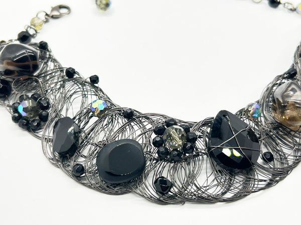 Black woven wire with stones necklace and adjustable fit for unique edgy style and bold elegance. The artistry and stunning apparance will make it a favorite. 