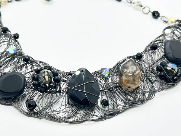 Black woven wire with stones necklace and adjustable fit for unique edgy style and bold elegance. The artistry and stunning apparance will make it a favorite. 