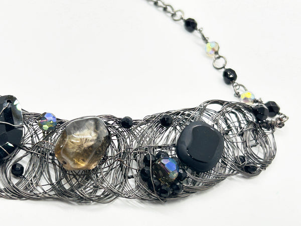Black woven wire with stones necklace and adjustable fit for unique edgy style and bold elegance. The artistry and stunning apparance will make it a favorite. 