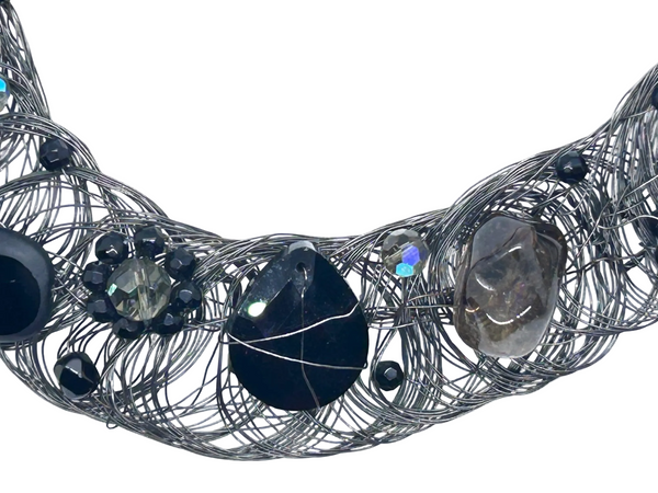 Black woven wire with stones necklace and adjustable fit for unique edgy style and bold elegance. The artistry and stunning apparance will make it a favorite. 