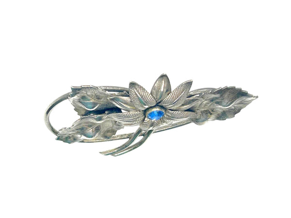 Vintage Silver-Tone Floral Brooch with Blue Rhinestone Center and Textured Leaves