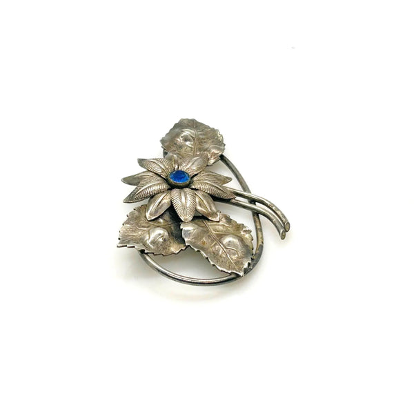Vintage Silver-Tone Floral Brooch with Blue Rhinestone Center and Textured Leaves