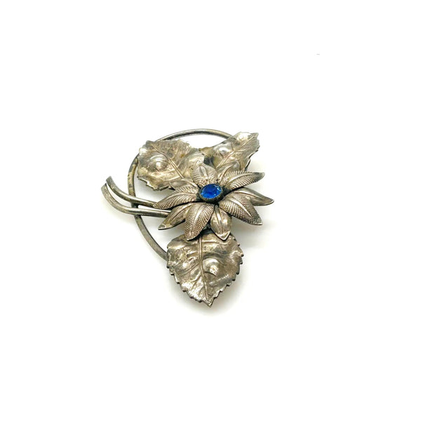 Vintage Silver-Tone Floral Brooch with Blue Rhinestone Center and Textured Leaves