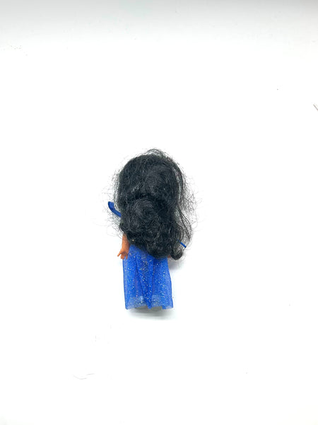 Vintage 2000 Mattel Kelly Club Performer Maria doll with long black hair, wearing her original sparkly blue circus dress and silver tiara, posed next to a blue star wand against a white background