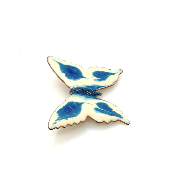 Perfect for collectors and vintage lovers: our Vintage Porcelain Blue and Cream Butterfly Brooch provides a hand-painted, unique enamel design. Shop today!