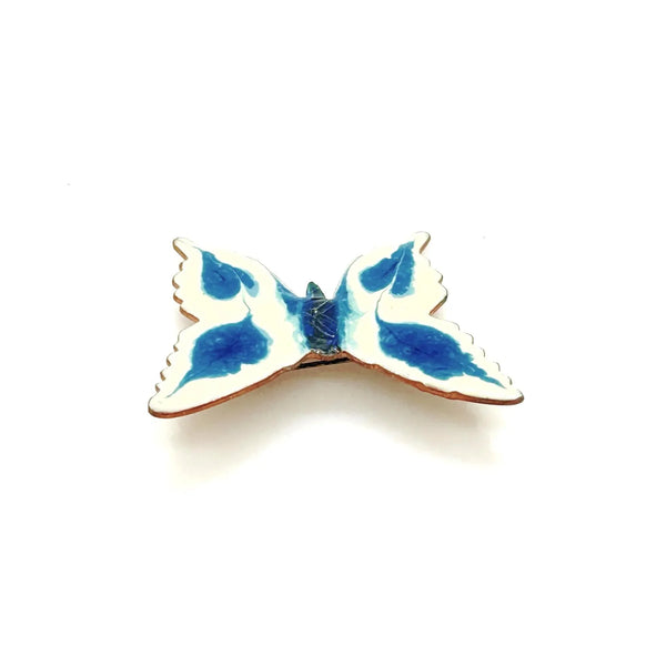 Perfect for collectors and vintage lovers: our Vintage Porcelain Blue and Cream Butterfly Brooch provides a hand-painted, unique enamel design. Shop today!