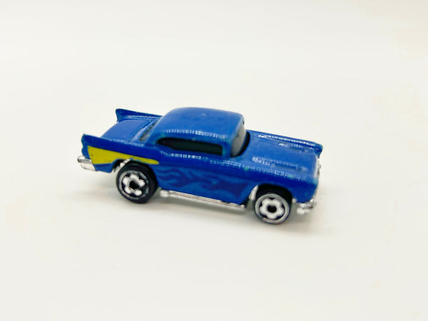 A vintage-style blue toy car with yellow side stripes and silver wheels, photographed on a plain light background.