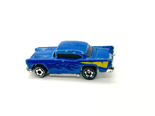 A small blue toy car with yellow flame decals and black wheels, photographed on a plain white background.