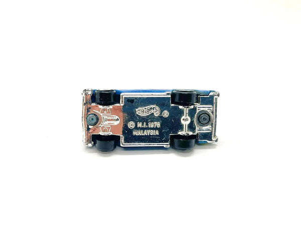 A vintage Hot Wheels toy car, specifically the 1970 Malaysia edition, shown upside down on a plain white background.