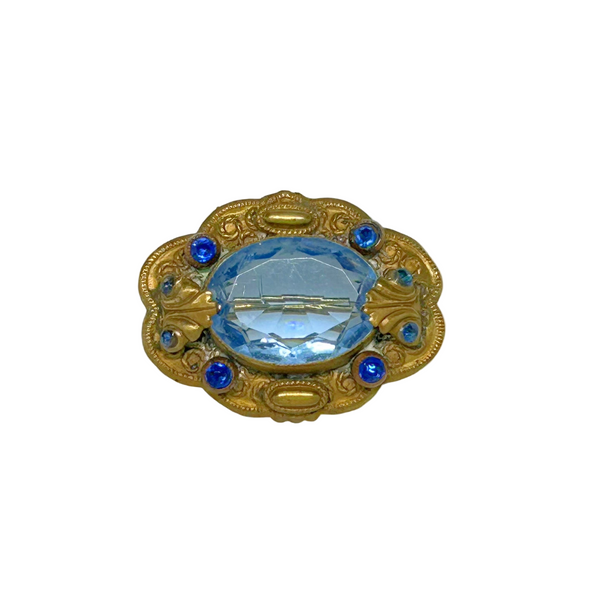 Beautiful Pale Blue Old World Brooch - Features intricate vintage craftsmanship with detailed metal and multiple shimmering blue stones. Shop now!
