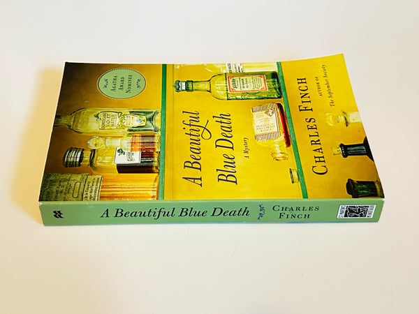 A Beautiful Blue Death by Charles Finch. Published in 2007, it is the debut novel in the Charles Lenox Mysteries series, which features a gentleman amateur sleuth in Victorian London