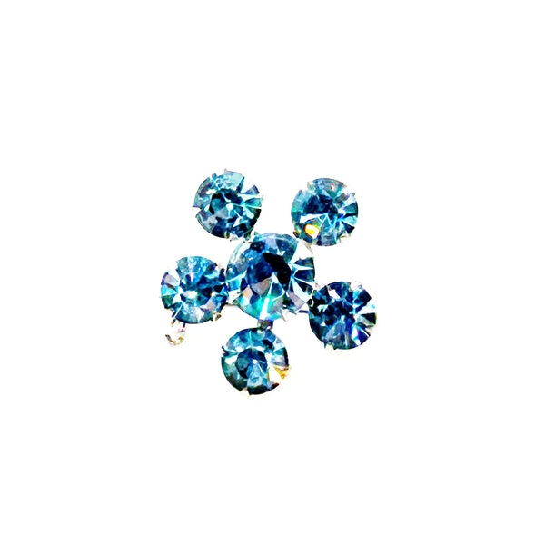 Measuring a delicate .75" across, this piece radiates timeless elegance. The unforgettable, eye-catching blue hue is beautifully complemented by the subtle "Coro" script signature discreetly placed on the back of the piece, adding a touch of authenticity and sophistication to this charming vintage treasure.