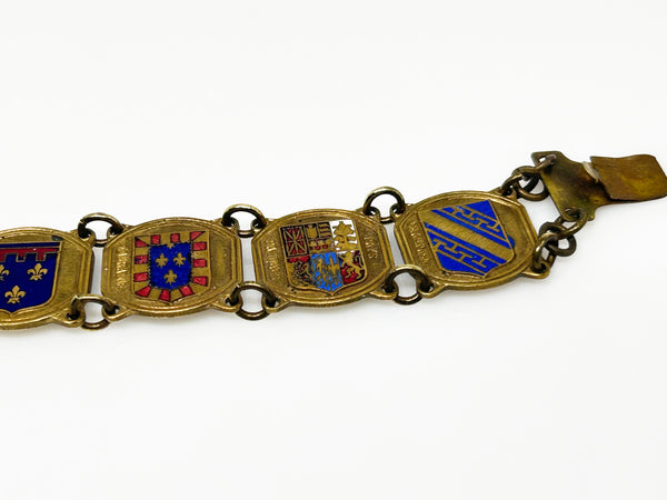Perfect for vintage jewelry lovers: our Vintage French Souvenir Panel Bracelet provides a stunning display of French heraldic crests. Shop today!
