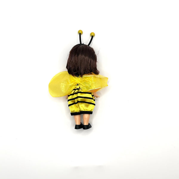 Rear product view of a 2001 Mattel Barbie Kelly Club Bumblebee Melody doll costume outfit, showcasing the striped fabric pattern and wing attachment details for collectors