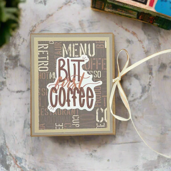 Capture your coffee adventures with the "But Coffee First!" Handmade Paper Craft Mini Album. This charming 4" x 3.25" journal is designed for easy organization, allowing you to beautifully preserve your favorite coffee moments. It's the perfect solution for creating a tidy and inspiring collection of memories, making it a must-have for any coffee lover.
