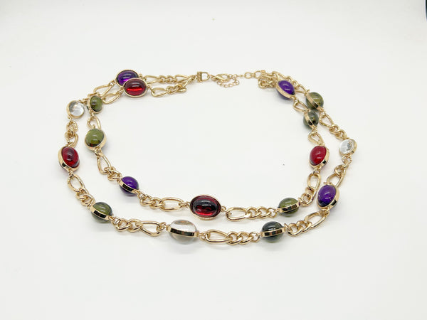 Vintage double strand station necklace with multicolor jewel-tone cabochons on a gold-tone chain link