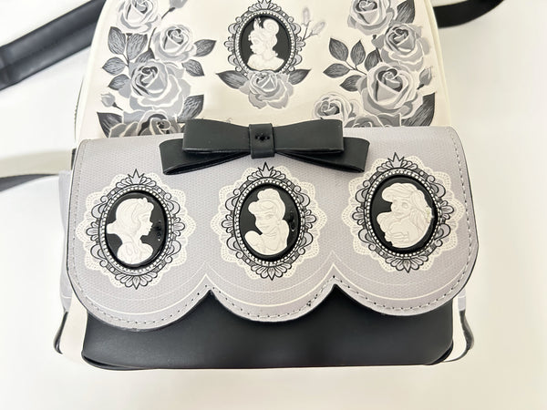 Loungefly Disney Princess Cameo Portraits Mini Backpack—a stunning 2024 release that celebrates timeless elegance! This cream vegan leather beauty showcases exquisite silhouette portraits of your favorite Disney Princesses in sophisticated black and white.