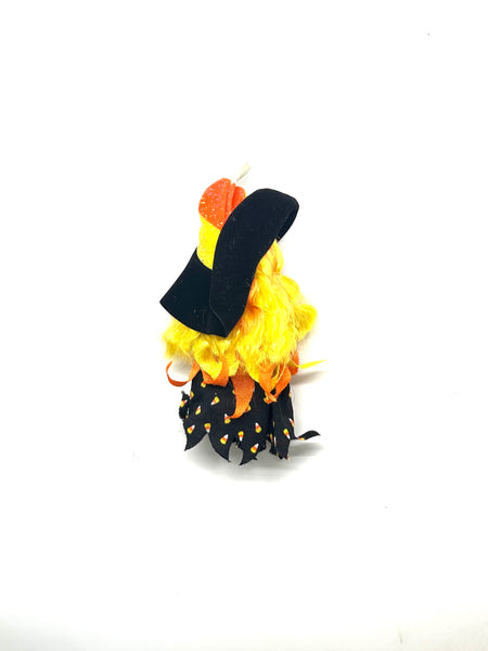 Vintage Mattel Barbie Kelly Club Halloween Party "Kelly is a Witch" doll. Loose mini doll wearing a candy corn themed witch costume with a black hat, standing against a white backdrop
