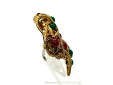 1960s vintage Capri openwork curl brooch featuring textured gold-tone metal set with green faux jade and red carnelian glass cabochons