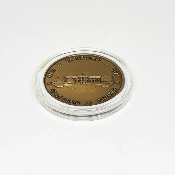 bronze-colored White House Military Office Challenge Coin. It features an image of the White House surrounded by the names of the five military branches: Army, Navy, Air Force, Marine Corps, and Coast Guard.