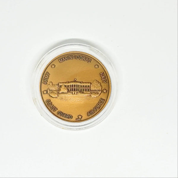 bronze-colored White House Military Office Challenge Coin. It features an image of the White House surrounded by the names of the five military branches: Army, Navy, Air Force, Marine Corps, and Coast Guard.