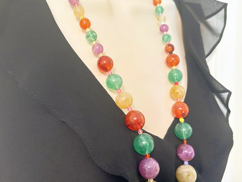 There’s something special about this Graduated Colorful Glass Bead Necklace! It’s stunning to look at and, if your senses are as active as your eyes, your other senses will enjoy it as well.&nbsp; Beads in purple,, jade green and dark red contrast beautifully with one another.