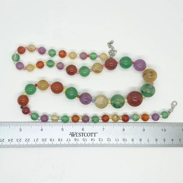 There’s something special about this Graduated Colorful Glass Bead Necklace! It’s stunning to look at and, if your senses are as active as your eyes, your other senses will enjoy it as well.&nbsp; Beads in purple,, jade green and dark red contrast beautifully with one another.