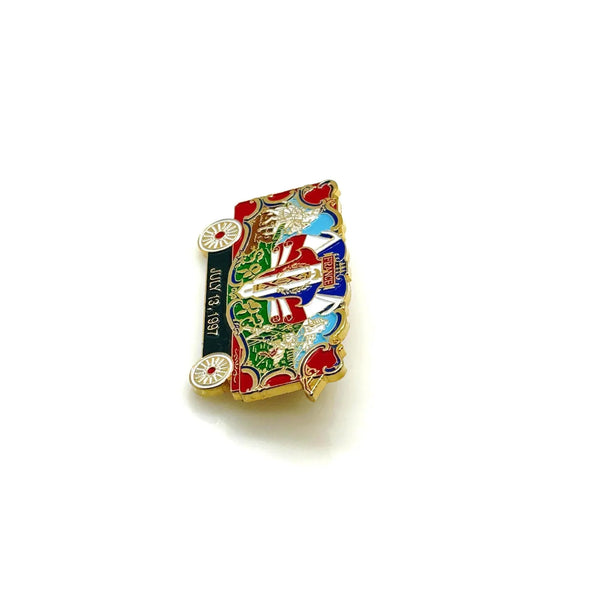 What a delightful piece of circus history! This charming vintage enamel lapel pin celebrates the France Bandwagon from the beloved Circus World Museum in Wisconsin, captured on July 13, 1997.